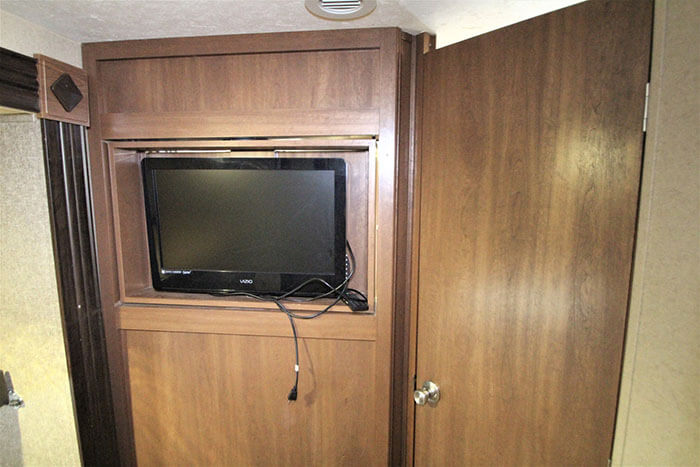 How do I get my TV to play sound through my RV speakers